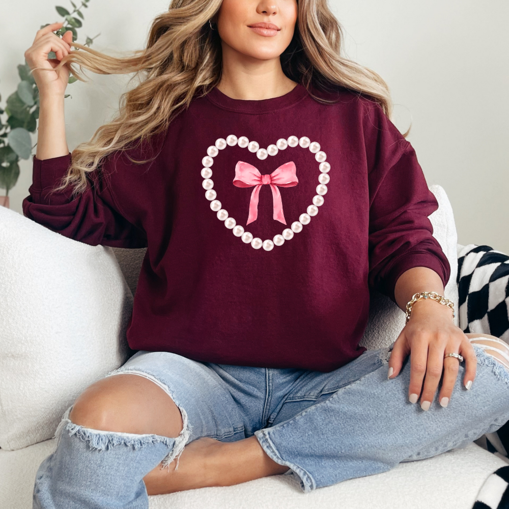 Pearl and bow heart  design-  sweater cute with oversized pearls and pink bow in the center