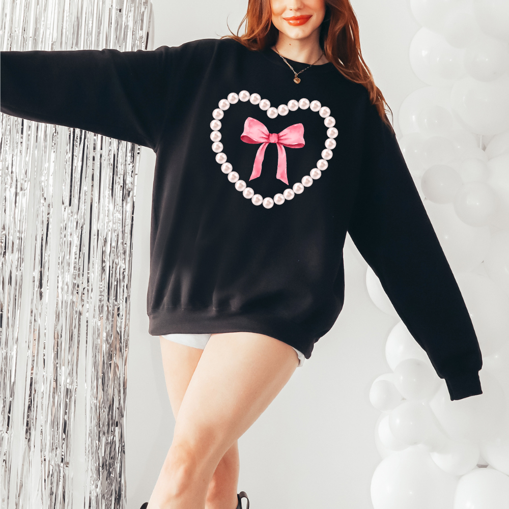 Pearl and bow heart  design-  sweater cute with oversized pearls and pink bow in the center