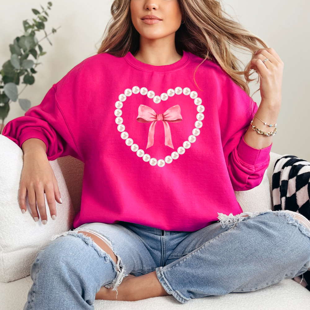 Pearl and bow heart  design-  sweater cute with oversized pearls and pink bow in the center