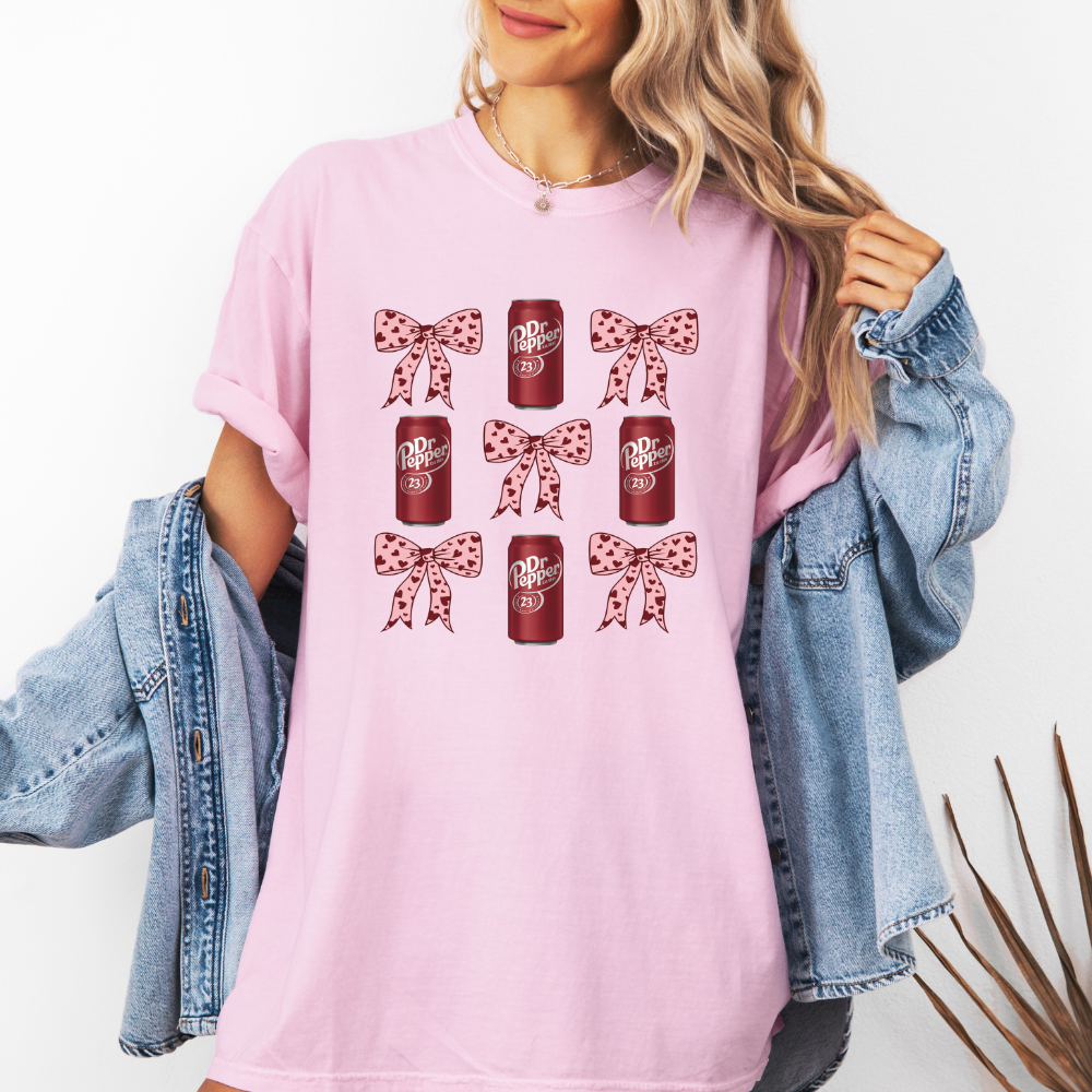 Dr. Pepper and pink bows- Blossom pink comfort colors T-shirt model wearing front view 
