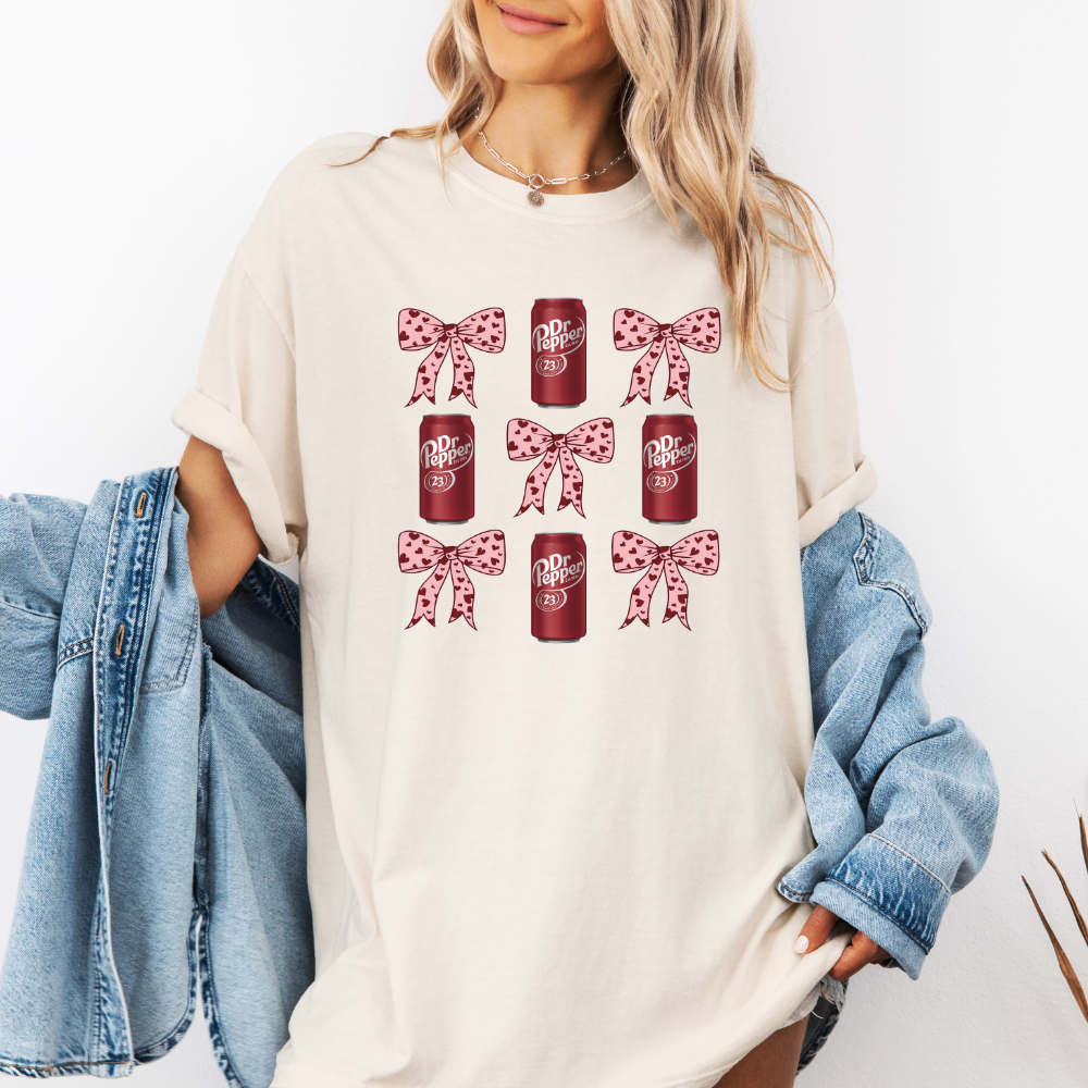 Dr. Pepper and pink bows- Blossom pink comfort colors T-shirt model wearing frontal view 