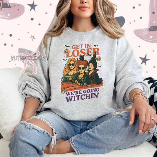 Person wearing a gray sweatshirt with a Halloween-themed graphic and text.