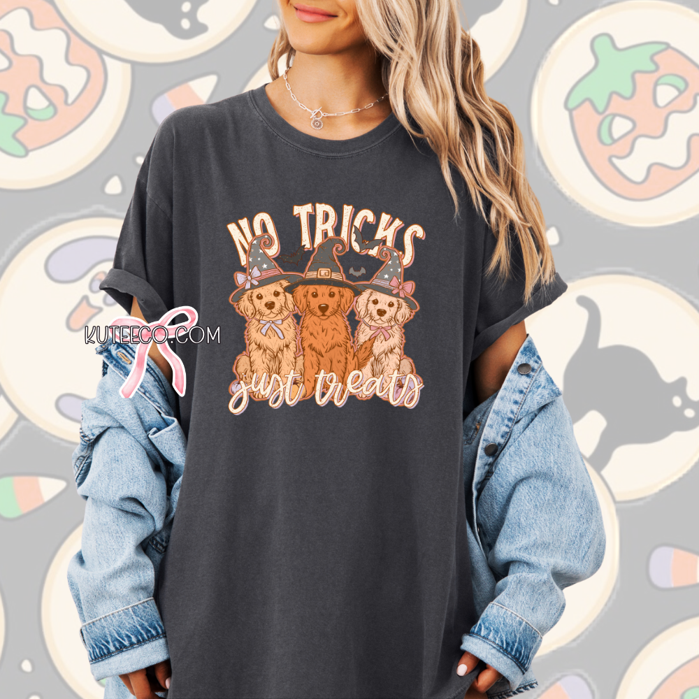 Person wearing a black t-shirt with Halloween-themed design and text, standing against a patterned background.