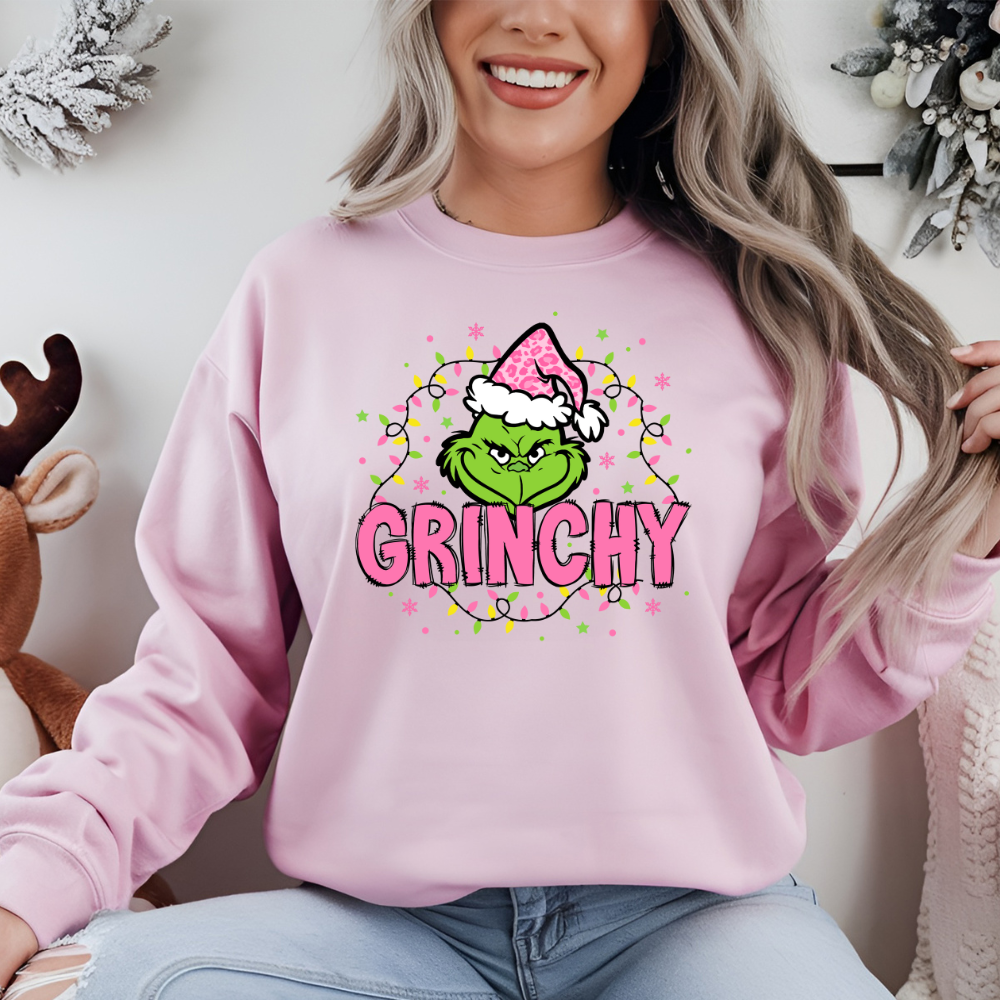 pink grinchy sweater with christmas lights